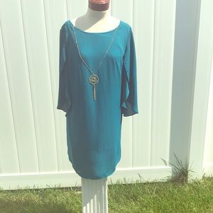 Large teal dress with necklace attached